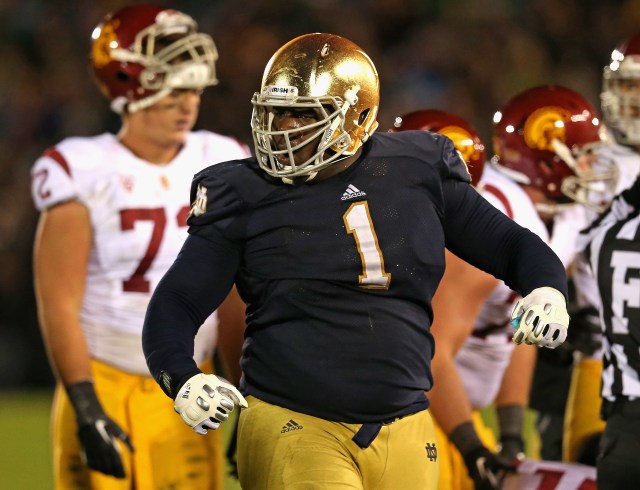 Louis Nix III #1 of the Notre Dame Fighting Irish celebrates near the end of the game against the University of Southern California Trojans at Notre Dame Stadium on October 19, 2013 in South Bend, Indiana. Notre Dame defeated USC 14-10. (Jonathan Daniel - Getty Images)
