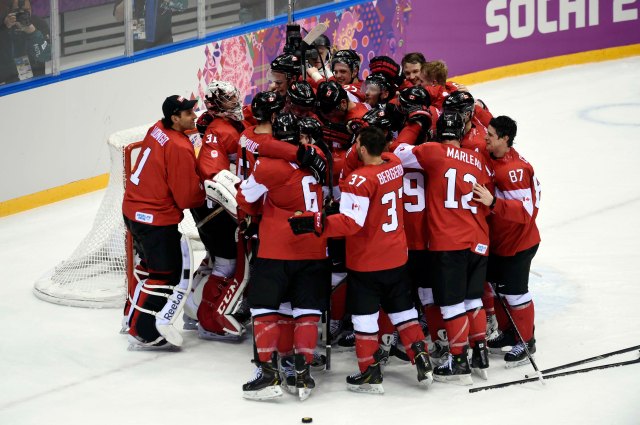 Canada celebrates winning gold in men's hockey at the Sochi Winter Olympics.  (Scott Rovak, USA TODAY Sports)