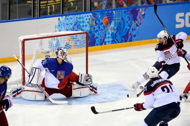 Phil Kessel scores his fifth goal of the Olympics by tipping a perfect pass from Ryan Kesler. (Scott Rovak, USA TODAY Sports.)