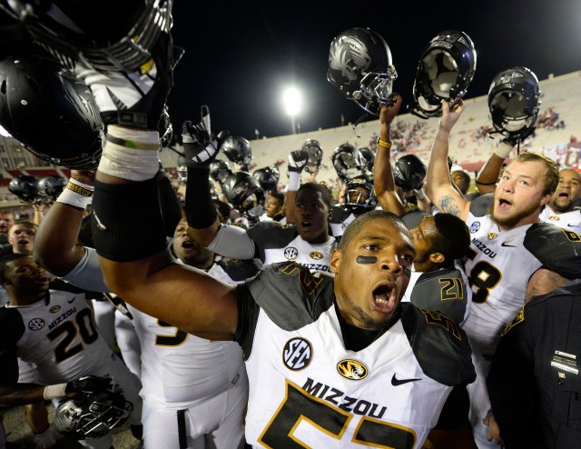 Michael Sam (52) celebrates beating Indiana last season. He'll be the first openly gay player entered in the draft. (Mike DiNovo-USA TODAY Sports)