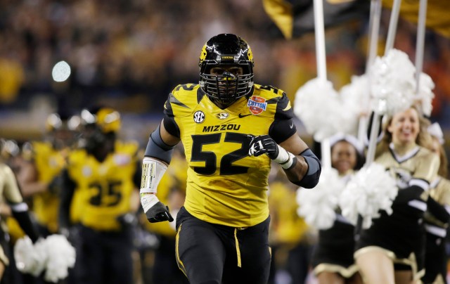Missouri Tigers defensive lineman Michael Sam runs on the field before the game against the Oklahoma State Cowboys at the 2014 Cotton Bowl at AT&T Stadium. (Tim Heitman - USA TODAY Sports)