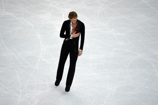 Evgeni Plushenko skates off after withdrawing because of an injury. (Credit: Kyle Terada-USA TODAY Sports)