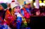 Julya Glubokaya of Russia watches opening ceremonies for the Sochi 2014 Winter Olympic Games on a video screen at a live site in the mountain cluster. (Guy Rhodes, USA TODAY Sports)