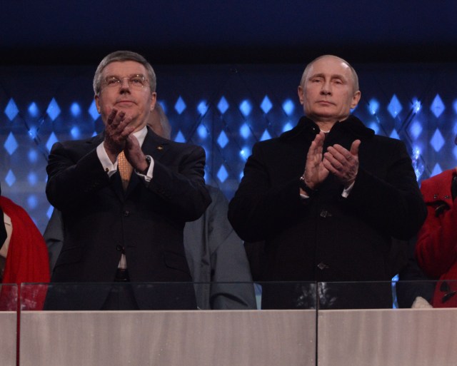 International Olympic Committee president Thomas Bach (left) and Russian president Vladimir Putin (right) wave to the crowd during the opening ceremony for the Sochi 2014 Olympic Winter Games at Fisht Olympic Stadium. (Robert Deutsch, USA TODAY Sports)
