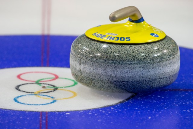 A stone sits on the ice during women's curling practice at Ice Cube Curling Center. (Kevin Liles, USA TODAY Sports)