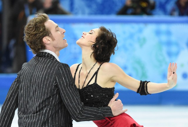 Nathallie Pechalat and Fabian Bourzat of France perform in the team ice dance short dance program during the Sochi 2014 Olympic Winter Games at Iceberg Skating Palace. Mandatory Credit: Robert Deutsch-USA TODAY Sports