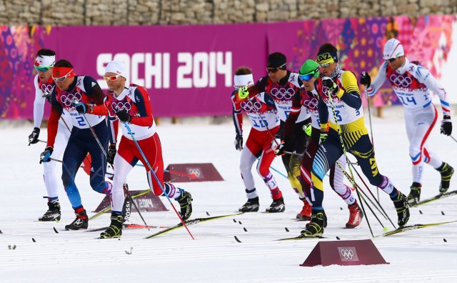Martin Johnsrud Sundby (NOR), Alexander Legkov (RUS) and Alexey Poltoranin (KAZ) at the start of the men's skiathlon during the Sochi 2014 Olympic Winter Games. (Guy Rhodes-USA TODAY Sports)