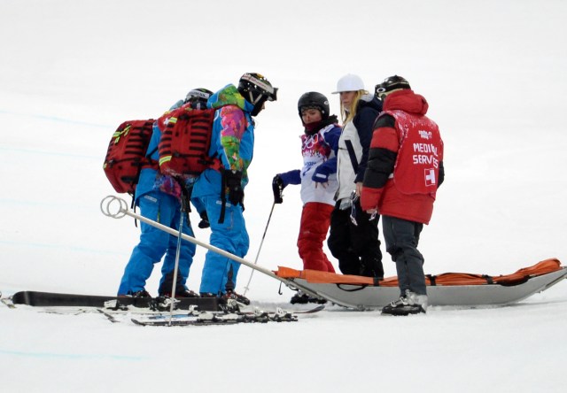 Anais Caradeux is helped after falling in her second run of qualification for the women's freestyle skiing halfpipe. (Jack Gruber-USA TODAY Sports)