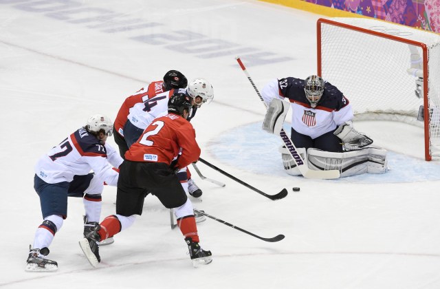 USA goalie Jonathan Quick (32) makes a save against Canada in the men's ice hockey semifinals during the Sochi 2014 Olympic Winter Games at Bolshoy Ice Dome. Richard Mackson-USA TODAY Sports.