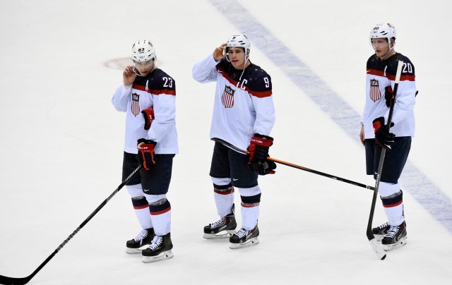 USA players Dustin Brown (23) , Zach Parise (9) and Ryan Suter (20) react after losing to Canada in the men's ice hockey semifinals during the Sochi 2014 Olympic Winter Games at Bolshoy Ice Dome. Richard Mackson-USA TODAY Sports.