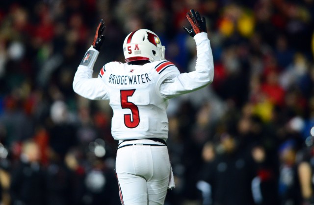 Louisville Cardinals QB Teddy Bridgewater, shown here playing against Cincinnati last season, has his pro day today. (Andrew Weber, USA TODAY Sports.)
