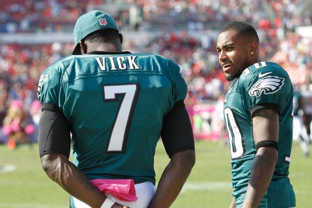 Philadelphia Eagles wide receiver DeSean Jackson (10) and quarterback Michael Vick (7) talk on the sidelines against the Tampa Bay Buccaneers at Raymond James Stadium. (Kim Klement - USA TODAY Sports)