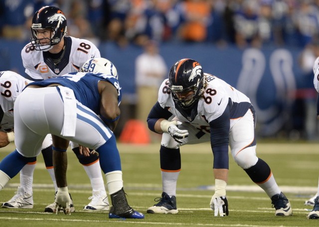 Denver Broncos quarterback Peyton Manning and guard Zane Beadles  against Indianapolis Colts at Lucas Oil Stadium. (Ron Chenoy - USA TODAY Sports)