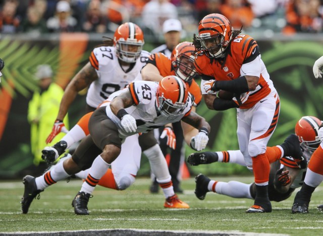 Cincinnati Bengals running back BenJarvus Green-Ellis runs with the ball as Cleveland Browns strong safety T.J. Ward defends. (Kevin Jairaj - USA TODAY Sports)