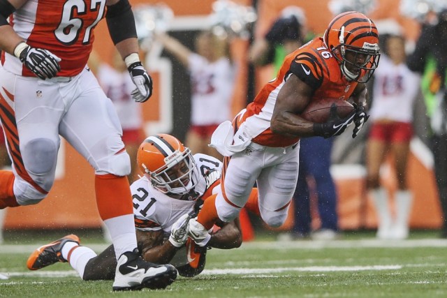 Cincinnati Bengals wide receiver Andrew Hawkins is tackled by Cleveland Browns cornerback Chris Owens at Paul Brown Stadium. (Kevin Jairaj - USA TODAY Sports)