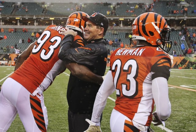 Cincinnati Bengals defensive end Michael Johnson hugs defensive coordinator Mike Zimmer during a game against the Cleveland Browns at Paul Brown Stadium. (Kevin Jairaj - USA TODAY Sports)