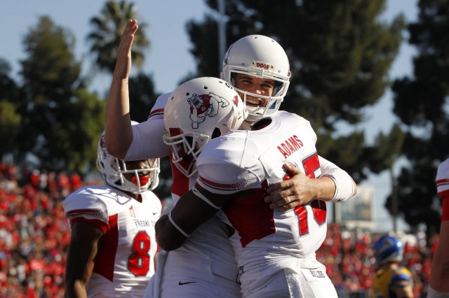 Fresno State Bulldogs wide receiver Davante Adams (15) is congratulated by quarterback Derek Carr (4) after scoring a touchdown against the San Jose State Spartans at Spartan Stadium. (Cary Edmondson - USA TODAY Sports)