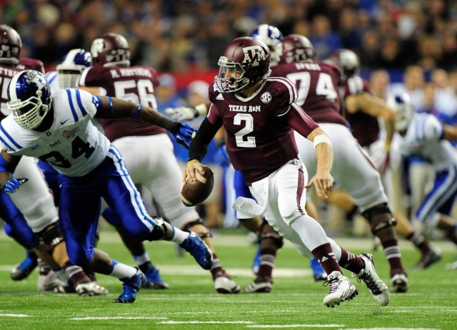 Texas A&M Aggies quarterback Johnny Manziel (2) runs the ball past Duke Blue Devils defense during the third quarter in the 2013 Chick-fil-A Bowl at the Georgia Dome. Kevin Liles-USA TODAY Sports.