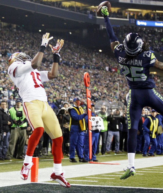 Seattle Seahawks cornerback Richard Sherman  tips a pass intended for San Francisco 49ers wide receiver Michael Crabtree that is intercepted by Seahawks outside linebacker Malcolm Smith (not pictured) in the fourth quarter of the 2013 NFC Championship game at CenturyLink Field. (William Perlman/THE STAR-LEDGER via USA TODAY Sports)