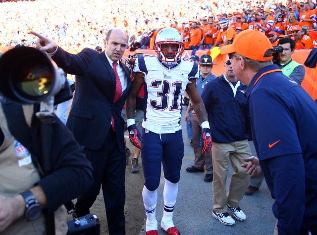 New England Patriots cornerback Aqib Talib is led off the field after suffering an injury against the Denver Broncos in the 2013 AFC Championship football game. (Mark J. Rebilas - USA TODAY Sports)