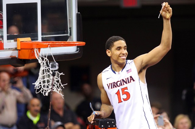 Virginia Cavaliers guard Malcolm Brogdon (15) celebrates by cutting the net after the Cavaliers game against the Syracuse Orange at John Paul Jones Arena. Geoff Burke-USA TODAY Sports.