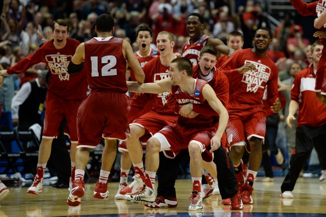 Wisconsin Badgers players celebrate after overtime in the finals of the west regional of the 2014 NCAA Mens Basketball Championship tournament against the Arizona Wildcats at Honda Center. The Badgers defeated the Wildcats 64-63.  Richard Mackson-USA TODAY Sports.