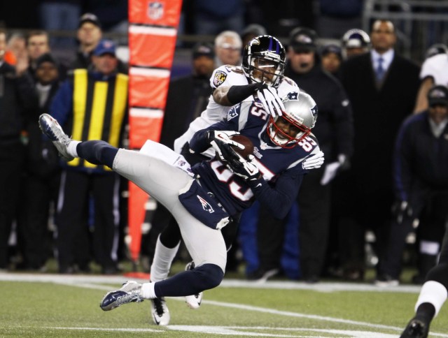 Brandon Lloyd catches a pass as Baltimore Ravens cornerback Cary Williams  defends during the AFC championship game at Gillette Stadium. (David Butler II - USA TODAY Sports)