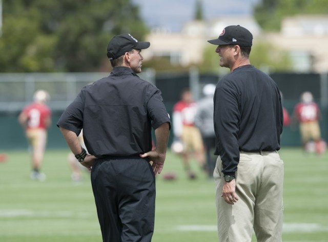 San Francisco 49ers general manager Trent Baalke (left) and head coach Jim Harbaugh chat during mincamp at San Francisco 49ers training facility. (Ed Szczepanski - USA TODAY Sports)