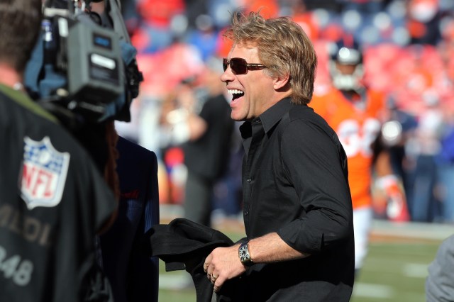 American musician Jon Bon Jovi on the field before during the 2013 AFC championship playoff football game between the Denver Broncos and the New England Patriots at Sports Authority Field at Mile High. (Matthew Emmons - USA TODAY Sports)