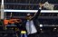 Connecticut Huskies head coach Kevin Ollie waves to fans after cutting down the net following the championship game of the Final Four in the 2014 NCAA Mens Division I Championship tournament against the Kentucky Wildcats at AT&T Stadium.  Robert Deutsch-USA TODAY Sports.