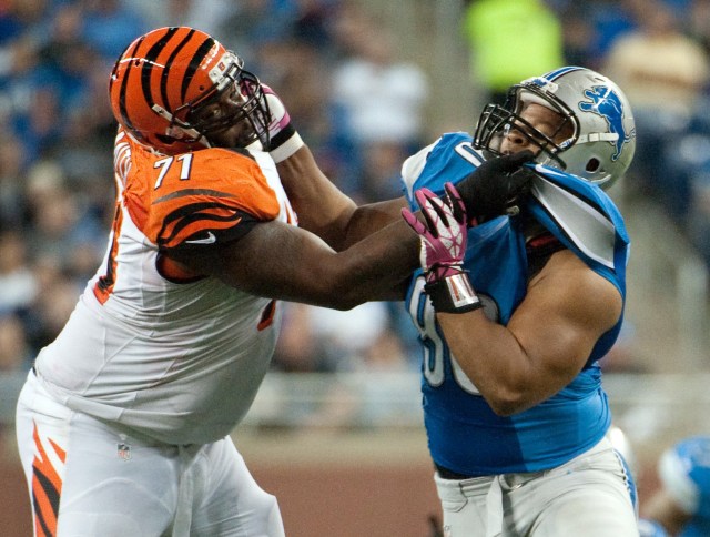 Cincinnati Bengals tackle Andre Smith blocks Detroit Lions defensive tackle Ndamukong Suh during a game at Ford Field. (Tim Fuller - USA TODAY Sports)
