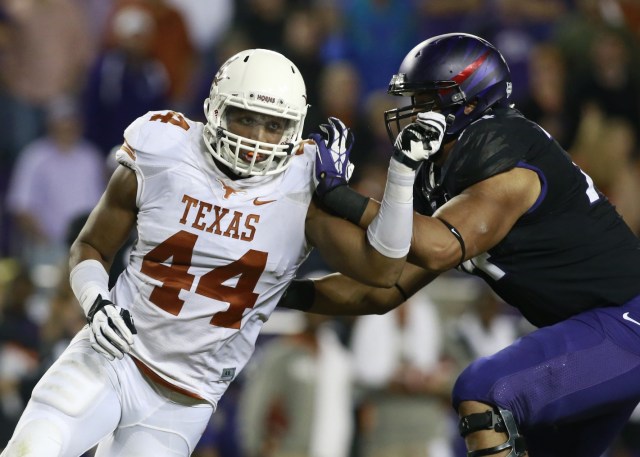 Former Texas Longhorns defensive end Jackson Jeffcoat rushes the passer against TCU Horned Frogs offensive tackle Halapoulivaati Vaitai at Amon G. Carter Stadium. (Tim Heitman - USA TODAY Sports)
