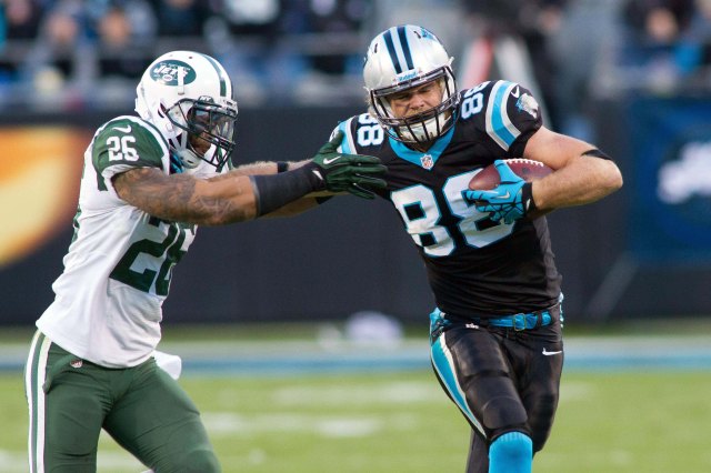 Carolina Panthers tight end Greg Olsen tries to stiff arm New York Jets strong safety Dawan Landry during a game at Bank of America Stadium. (Jeremy Brevard - USA TODAY Sports)