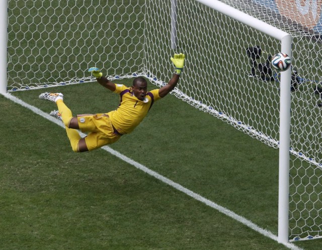 Nigeria's goalkeeper Vincent Enyeama jumps to attempt a save on a shot at goal by France's Paul Pogba. (David Gray, REUTERS)