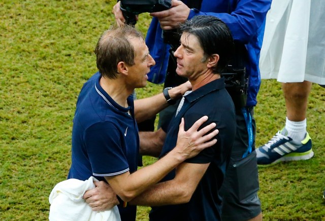 U.S. coach Juergen Klinsmann (L)  hugs Germany's coach Joachim Low. (REUTERS/Ruben Sprich)