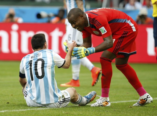 Nigeria's goalkeeper Vincent Enyeama, shown here helping Lionel Messi to his feet, gave up three goals to Argentina and must improve if his squad is to have any chance against France. (Edgard Garrido, REUTERS)