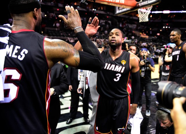 Dwyane Wade and LeBron James high-five after Game 2. (Bob Donnan, USA TODAY Sports)