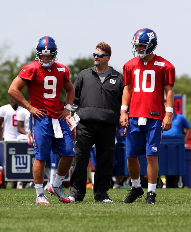 Giants QBs Ryan Nesbitt, left, and Eli Manning, right, confer with new offensive coordinator Ben McAdoo during a training camp practice. (Noah K. Murray, USA TODAY Sports)