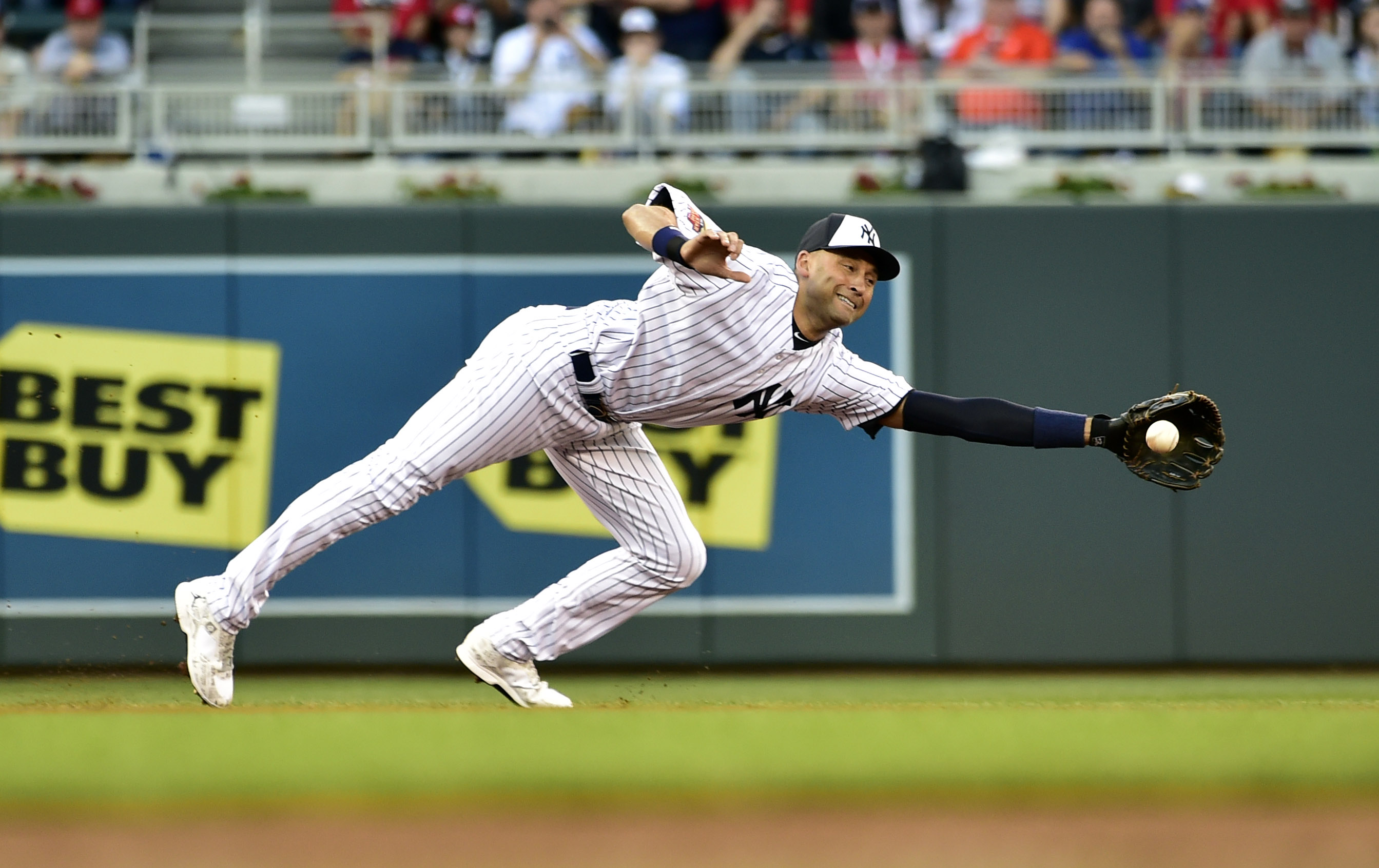Derek Jeter makes a diving stop on a ball hit by Andrew McCutchen to lead off the 85 All-Star Game. (Scott Rovak, USA TODAY Sports)