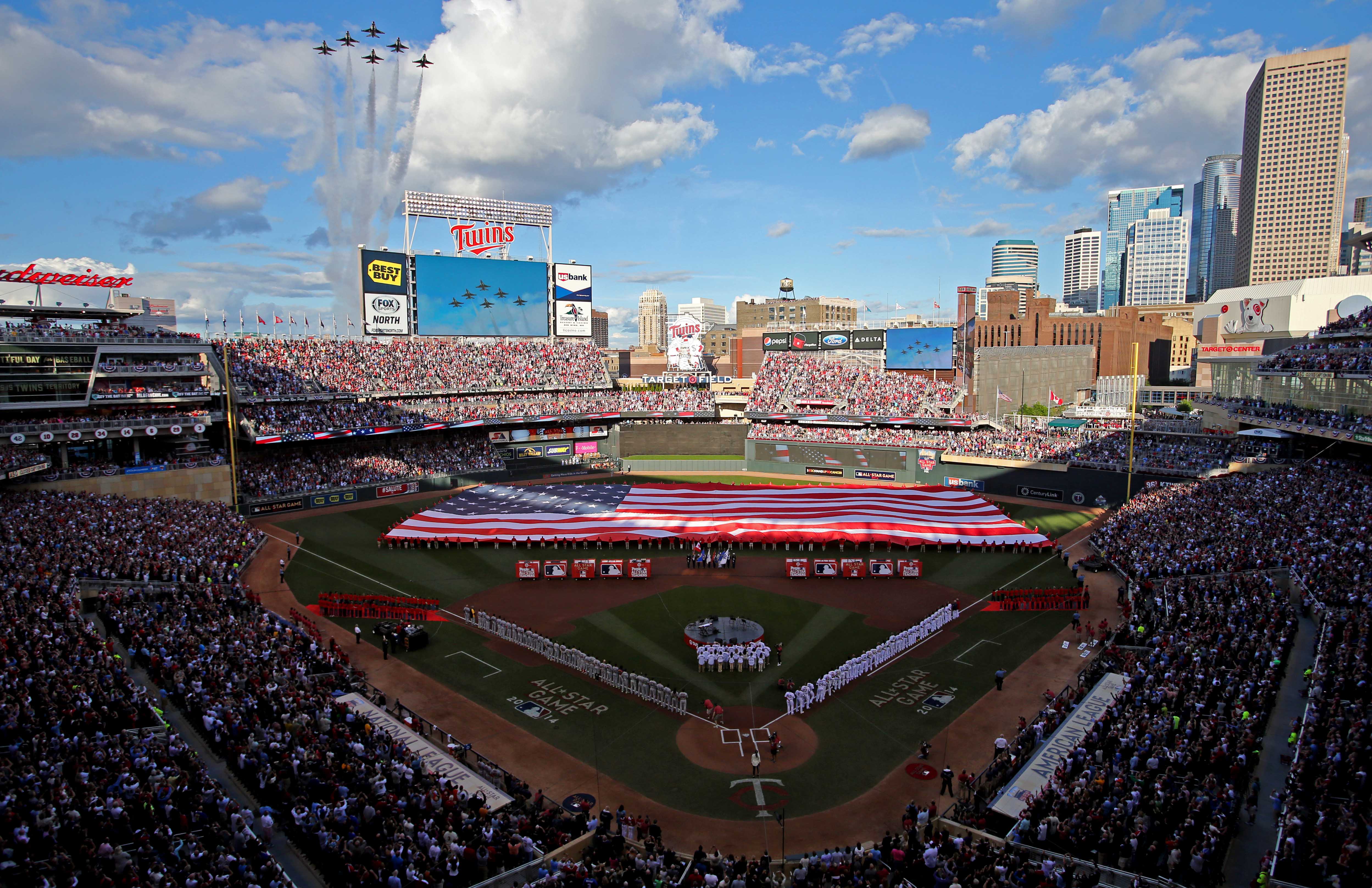 The U.S. Air Force Thunderbirds perform a flyover during the national anthem before the All Star Game at Target Field. 