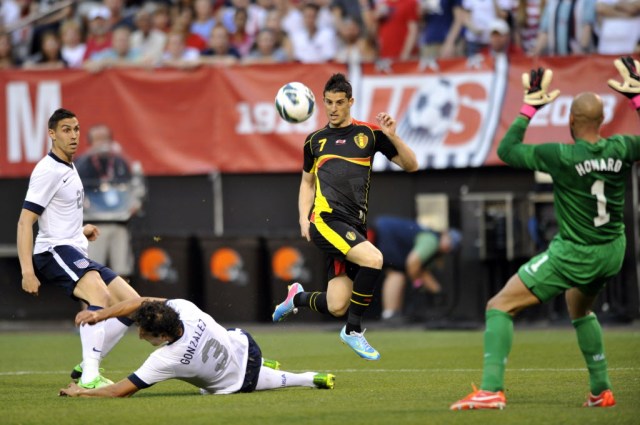 Belgium forward Kevin Mirallas (7) leaps in the air while scoring a goal against the USA in the first half . (David Richard, USA TODAY Sports)