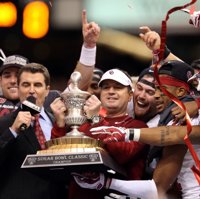 This is Bob Stoops holding a trophy after his team walloped Alabama. (Chuck Cook, USA TODAY Sports) 