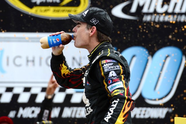Jeff Gordon celebrates his  victory in the Pure Michigan 400 with a Pepsi that somebody has clearly been shaking. (Andrew Weber, USA TODAY Sports)