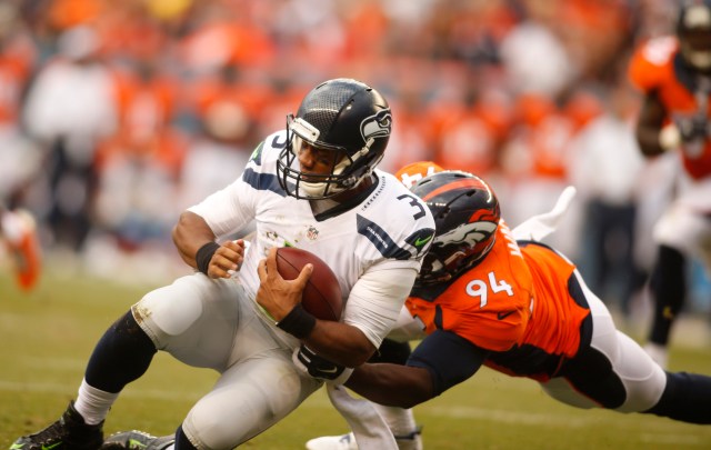 Broncos defensive end DeMarcus Ware (94) sacks Seattle Seahawks quarterback Russell Wilson. (Chris Humphreys-USA TODAY Sports)