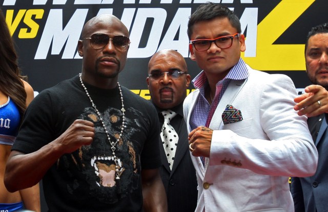 Floyd Mayweather, left, wants to go out on his terms, but must get through a rematch with Marcos Maidana first. (Noah K. Murray, USA TODAY Sports)