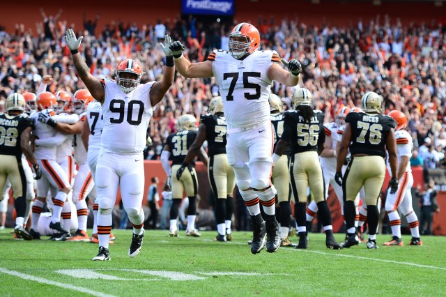 Cleveland Browns defensive end Billy Winn (90) and guard Joel Bitonio (75) celebrate after Billy Cundiff (not pictured) kicked the game winning field goal to defeat the New Orleans Saints. (Andrew Weber-USA TODAY Sports)