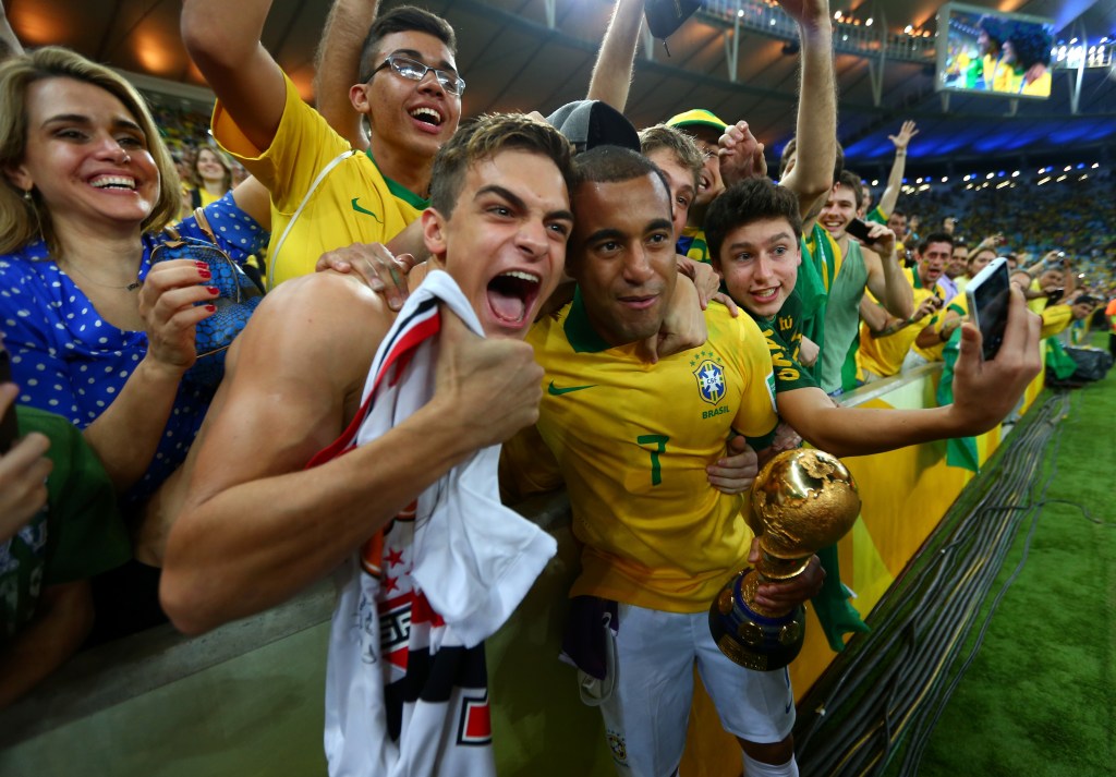 Brazil's Lucas celebrates with fans. (Photo by Jasper Juinen/Getty Images)