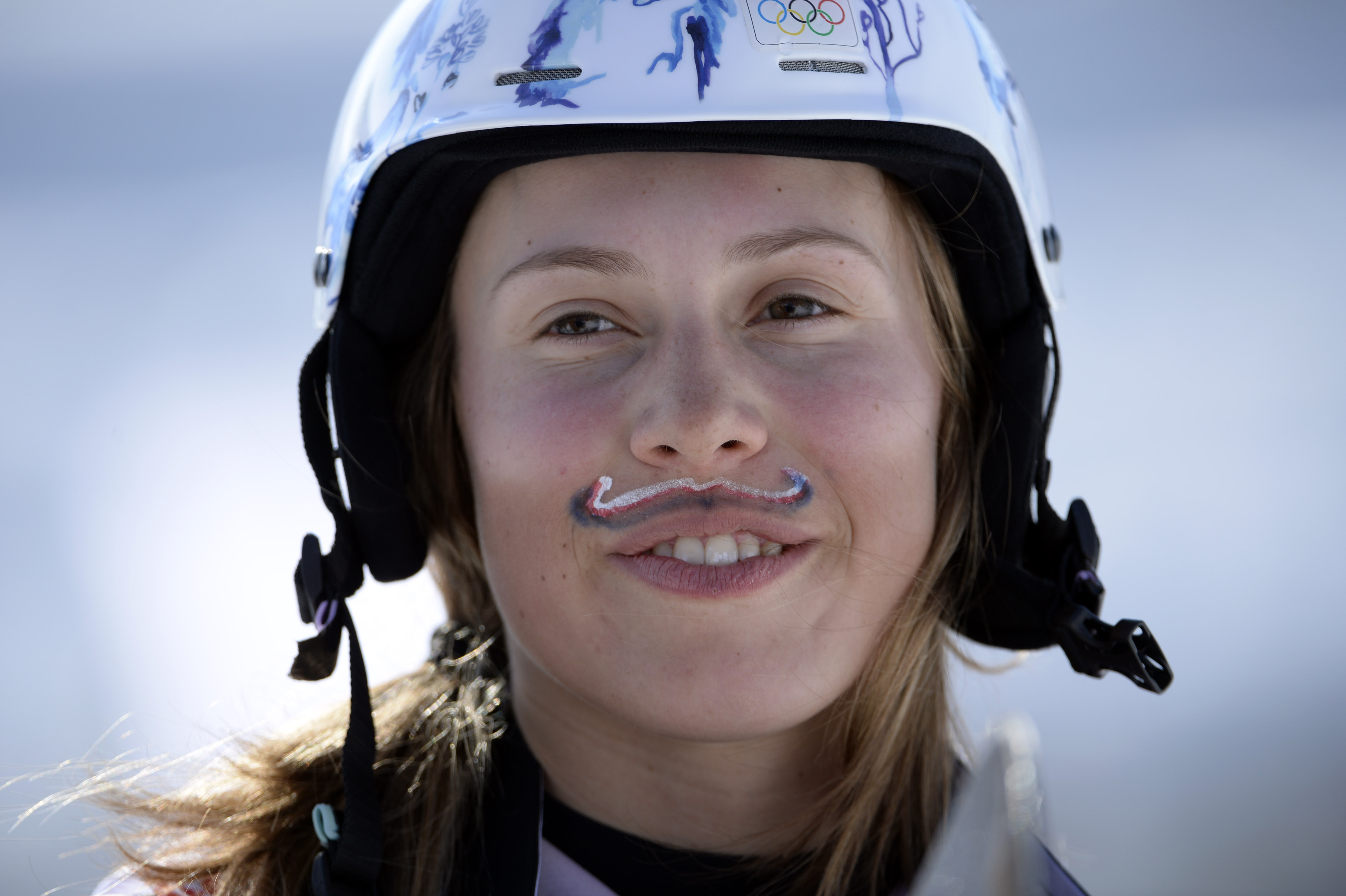 Why was this female gold medalist sporting a painted mustache