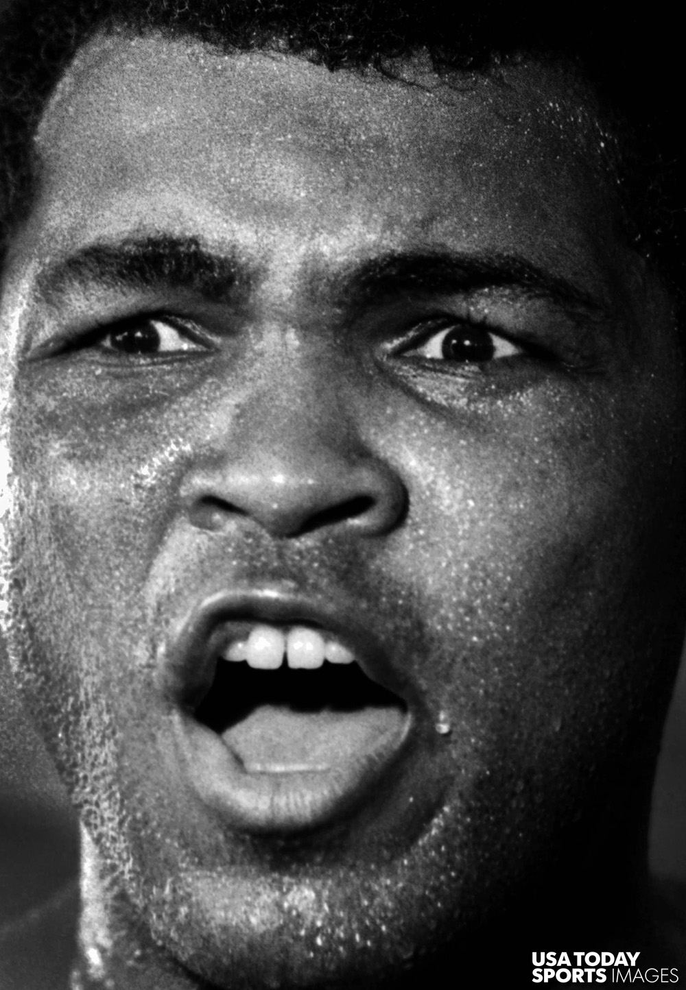 (Muhammad Ali reacts during a training session at the 5th Street Gym in Miami Beach, Florida prior to his 1980 fight against Larry Holmes. // Credit: Robert Mayer, USA TODAY Sports)