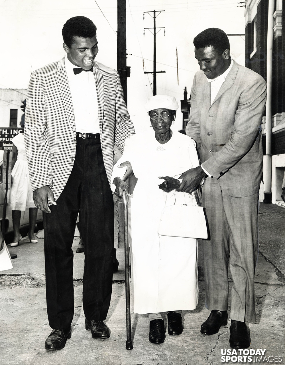 Cassius Clay, later known as Muhammad Ali (left), and his brother Rudy Clay, later known as Rahman Ali (right), walk with their great-grandmother Betsy Jane Greathouse (center) who was 99 when this picture was taken in 1963 in Louisville.  //  Credit: Charles Fentress Jr., The Courier-Journal, USA TODAY Sports